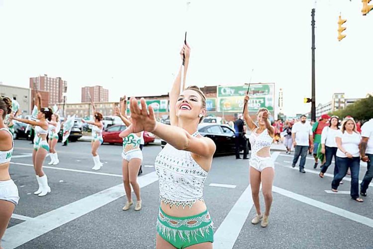 Lily Wright leads other majorettes on Sept. 24 outside Joan C. Edwards Stadium in Huntington. (Photo provided by Super #1 Photography Buffet)